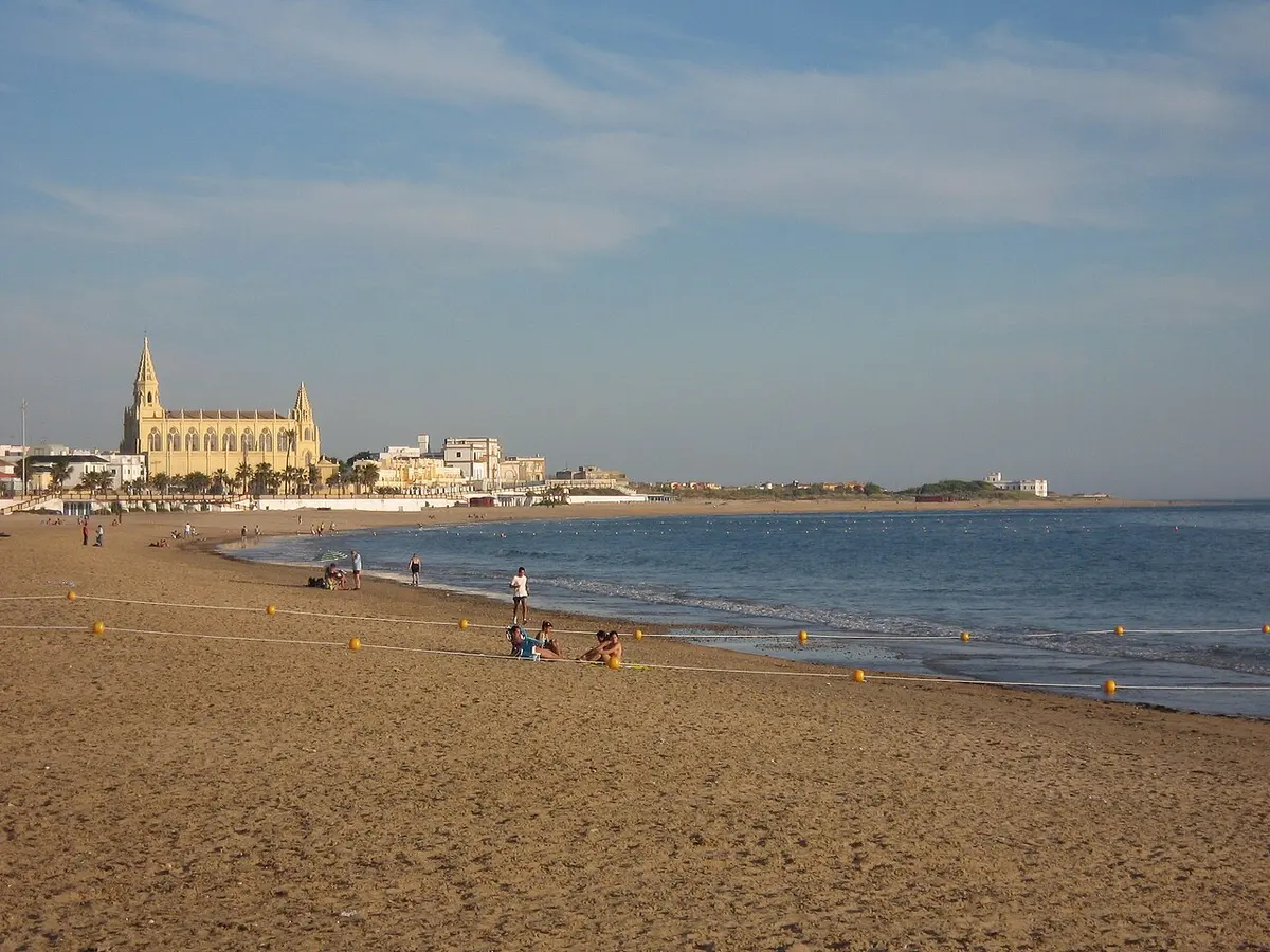 Playa de Regla, Chipiona, Chipiona, Cadiz, Costa de la Luz - wide town beach beside a sanctuary and a tall lighthouse