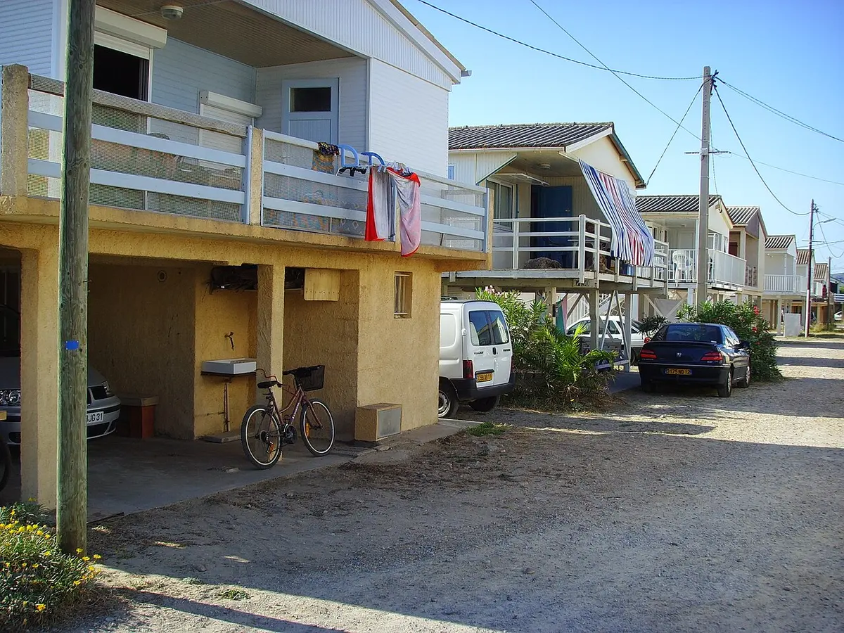 Plage de Gruissan, Occitanie, Gruissan, Aude, Occitanie - long sandy beach with stilt houses on the aude coast