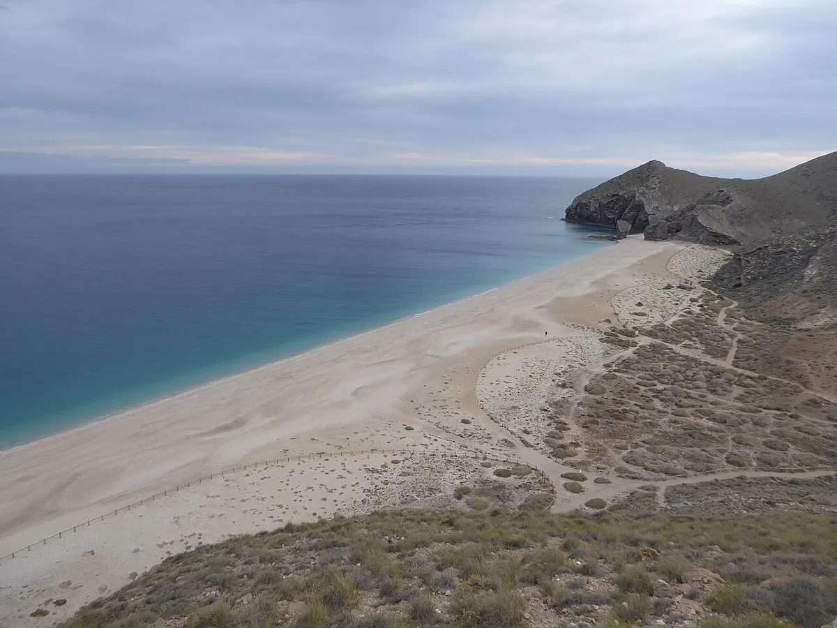Playa de los Muertos, Carboneras, Carboneras, Almeria, Andalusia - wild pebble and sand beach below a rock stack