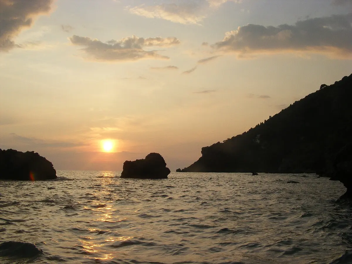 Myrtiotissa Beach, Corfu, Myrtiotissa, Corfu, Ionian Islands - golden sand below steep green cliffs on the west coast of corfu