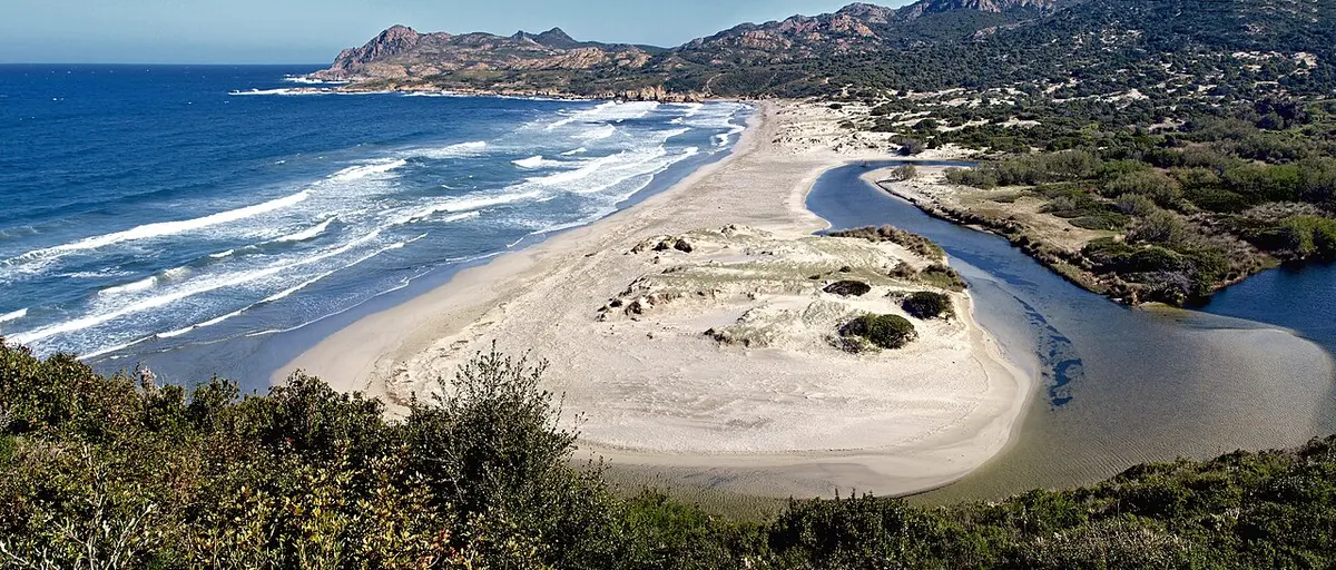 Ostriconi Beach, Ostriconi, Desert des Agriates, Corsica - wide sandy beach with dunes and a river mouth