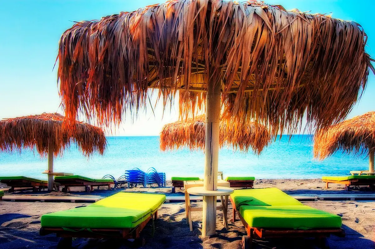 Perivolos Beach, Santorini, Perivolos, Santorini - long black sand beach lined with beach bars