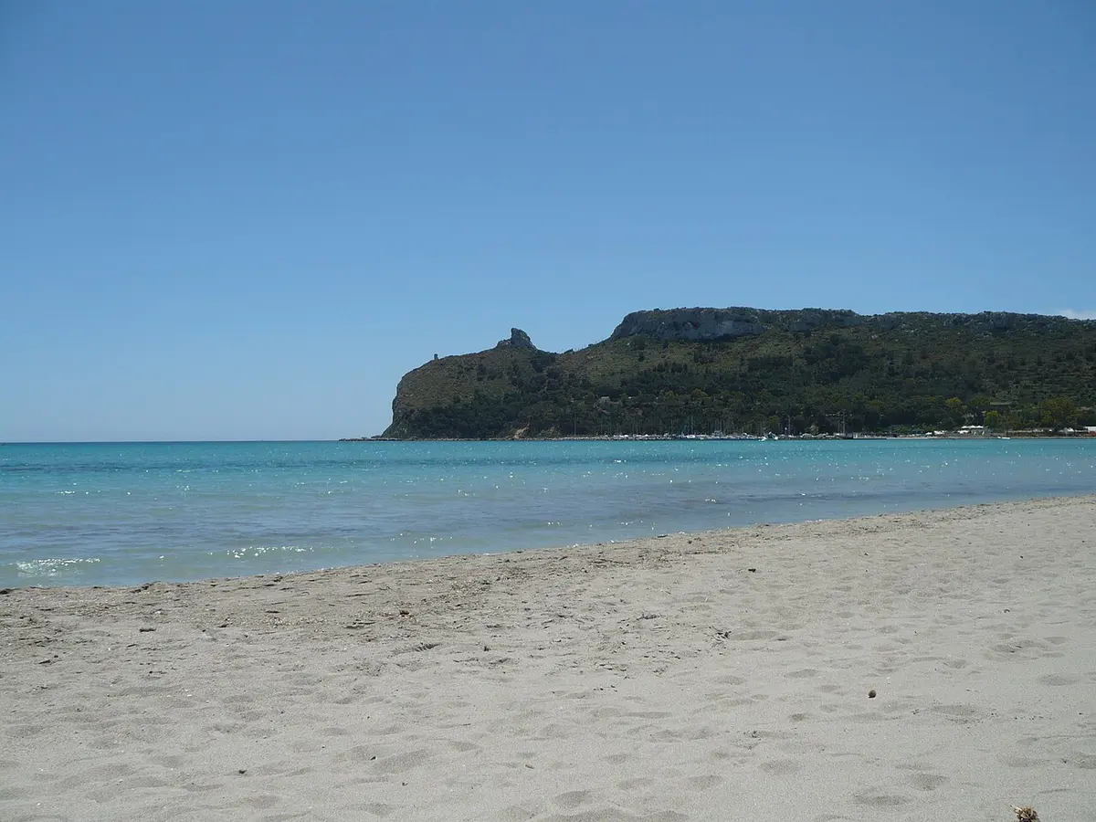 Spiaggia del Poetto, Cagliari, Cagliari, Sardinia - long city beach beneath a rocky headland