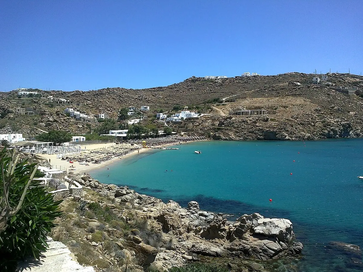 Super Paradise Beach, Plintri, Mykonos - mykonos beach club cove below a steep hillside