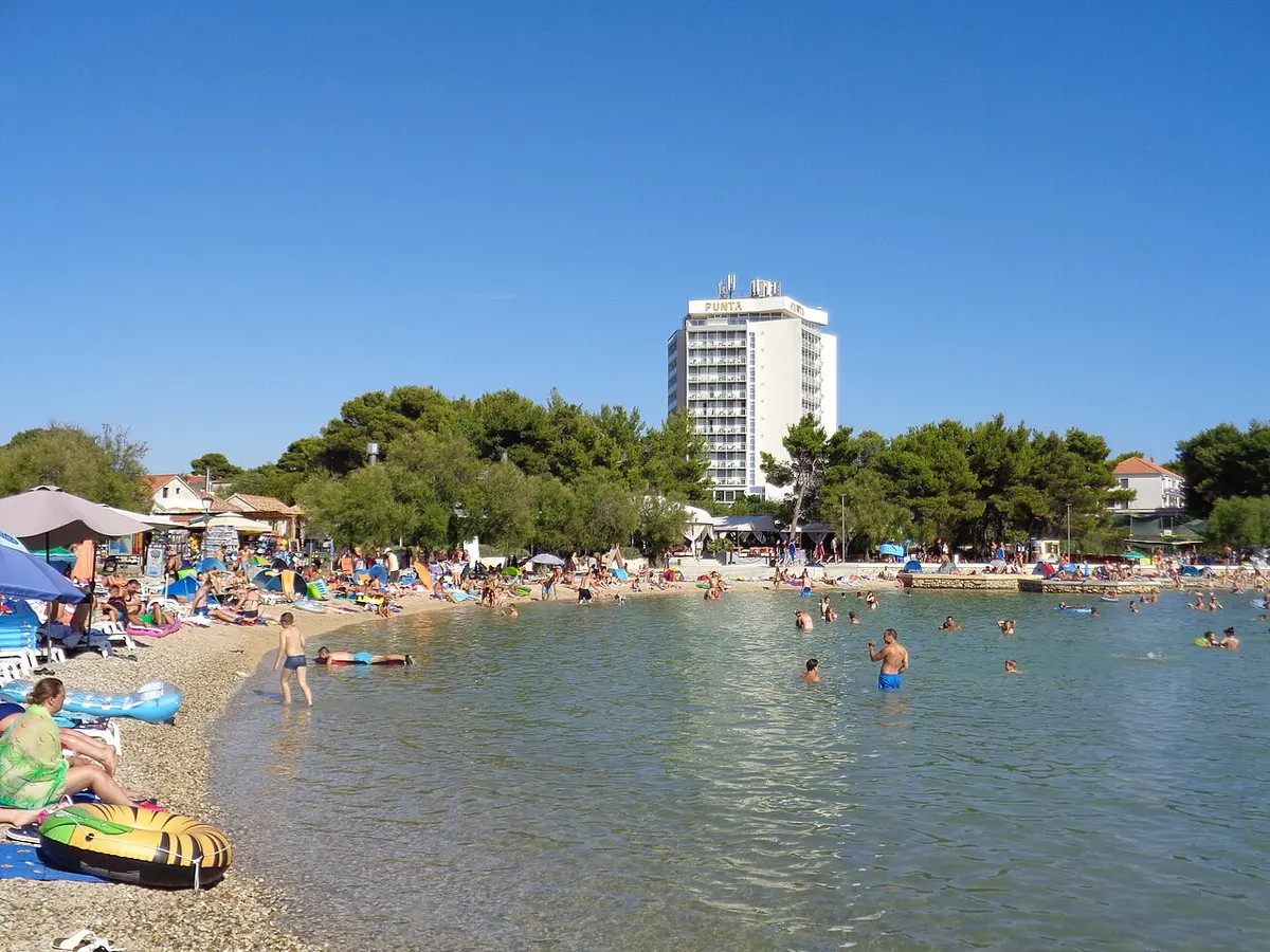 Vodice Beach, Vodice, Dalmatia - calm pebble bay with pine shade