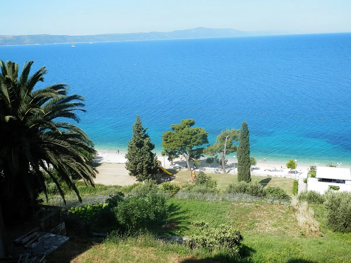 Zivogosce Beach, Makarska Riviera, Zivogosce, Makarska Riviera, Split-Dalmatia, Croatia - long pebble beach with pine trees on the makarska riviera